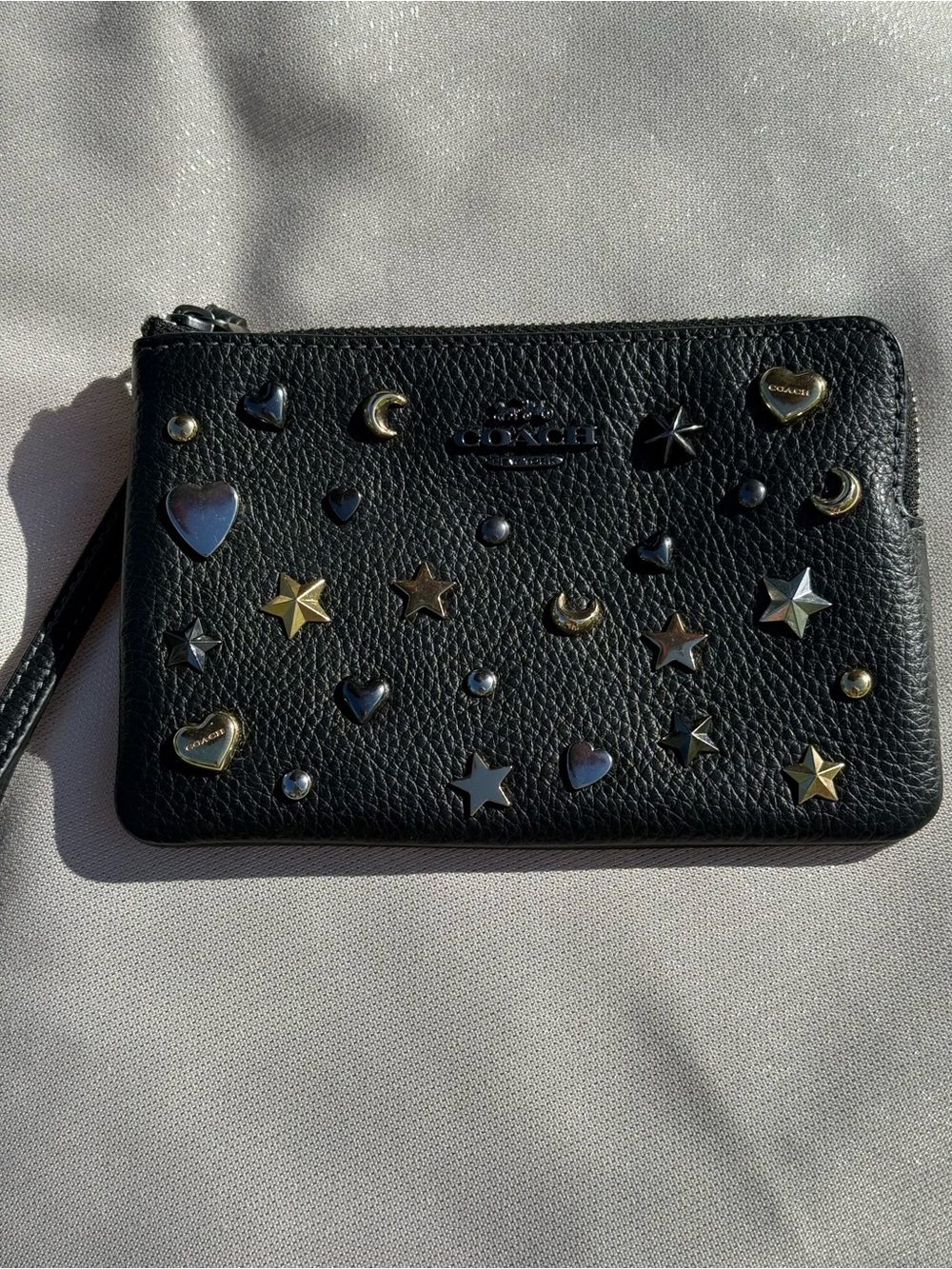 Coach Black Pebbled Leather Star & Heart Stud Wristlet with Metallic Accents - Picture 1 of 5